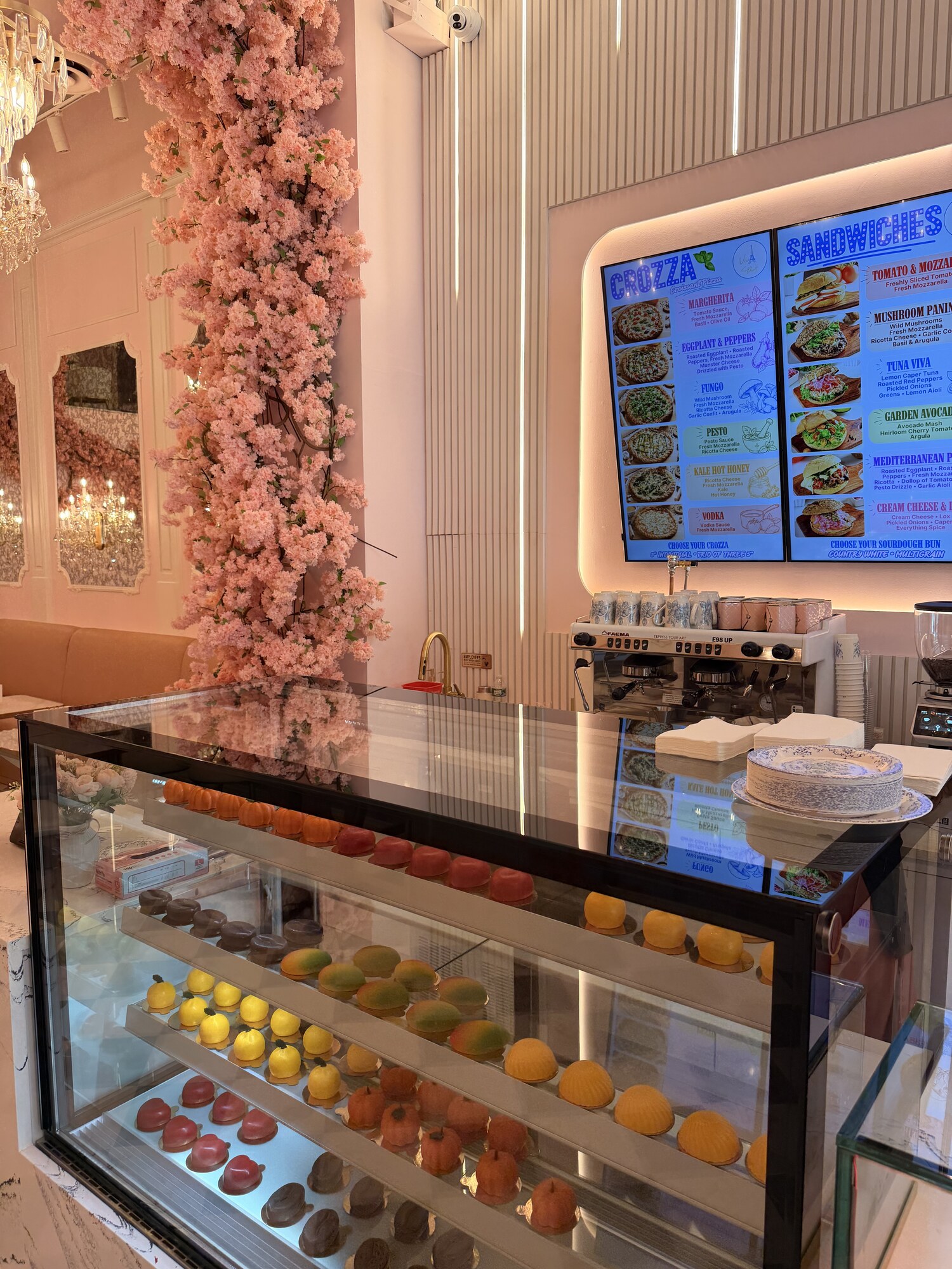 Fruit-shaped mousse pastries in the display case at Viva La Dough Midtown