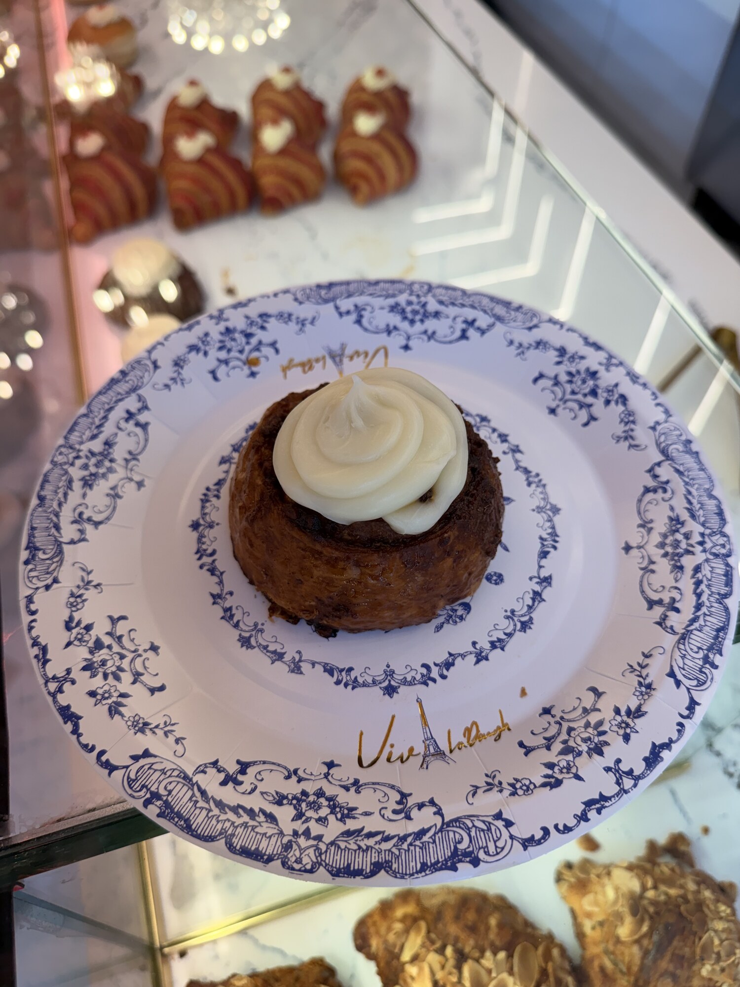 Cruffin with cream on a Viva La Dough branded plate