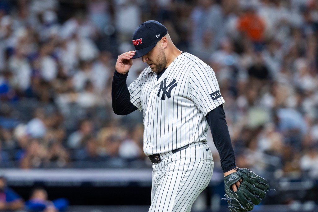 New York Yankees pitcher David Bednar walks off the mound after ending the eighth inning.