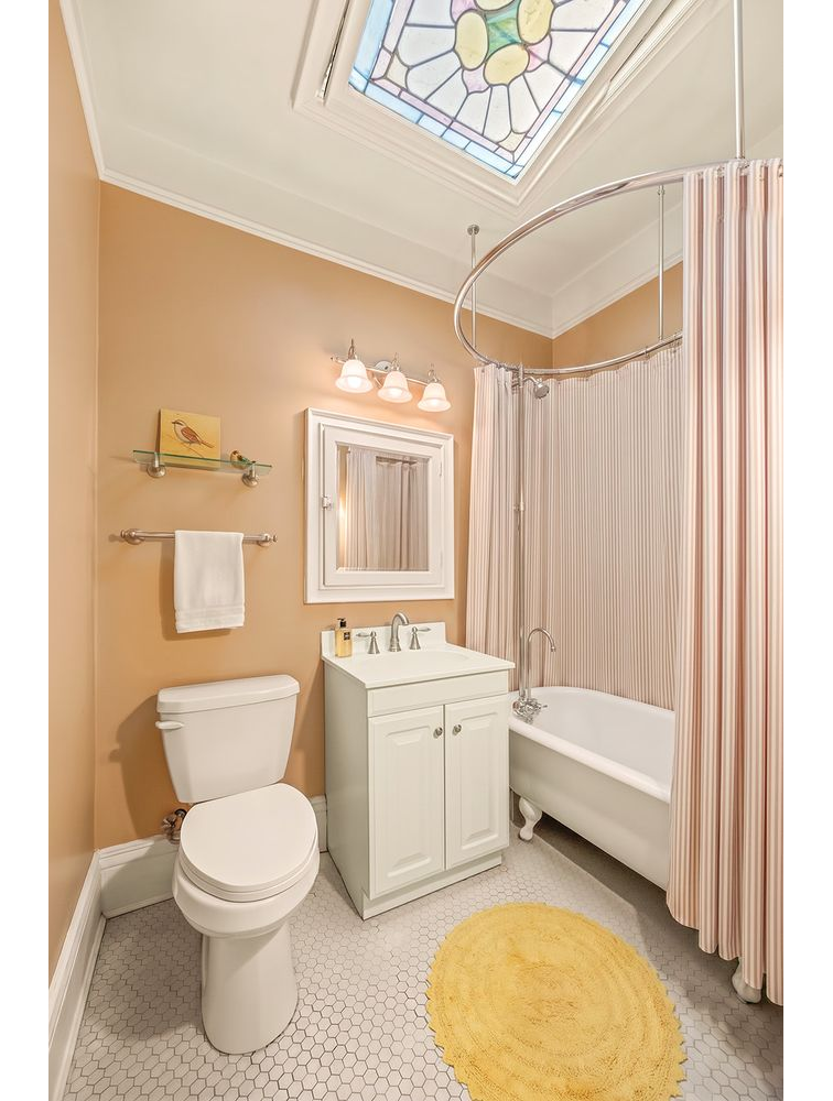bathroom with stained glass skylight