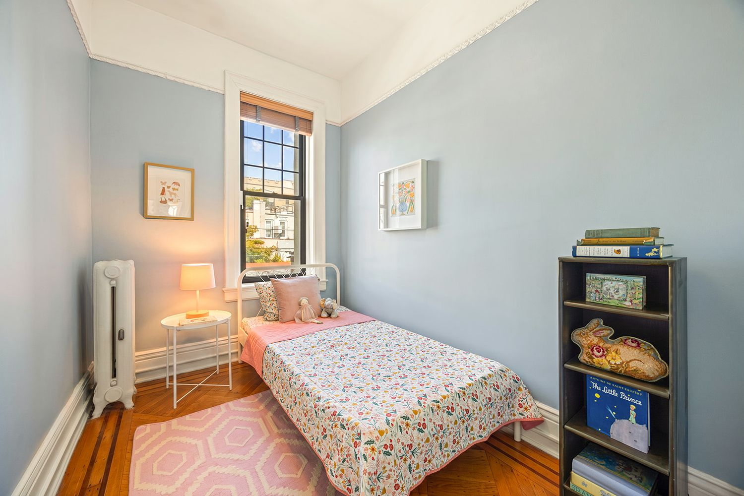narrow bedroom with blue walls