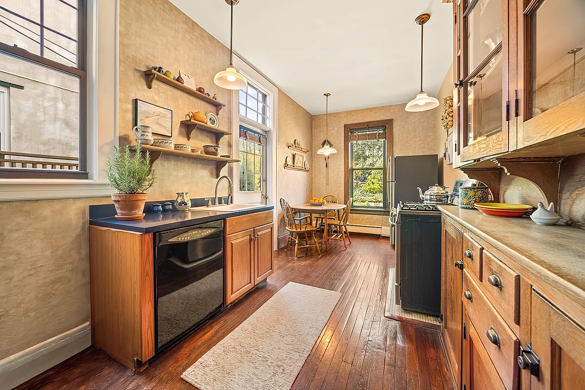 kitchen with wood floor, original built-in china cabinet