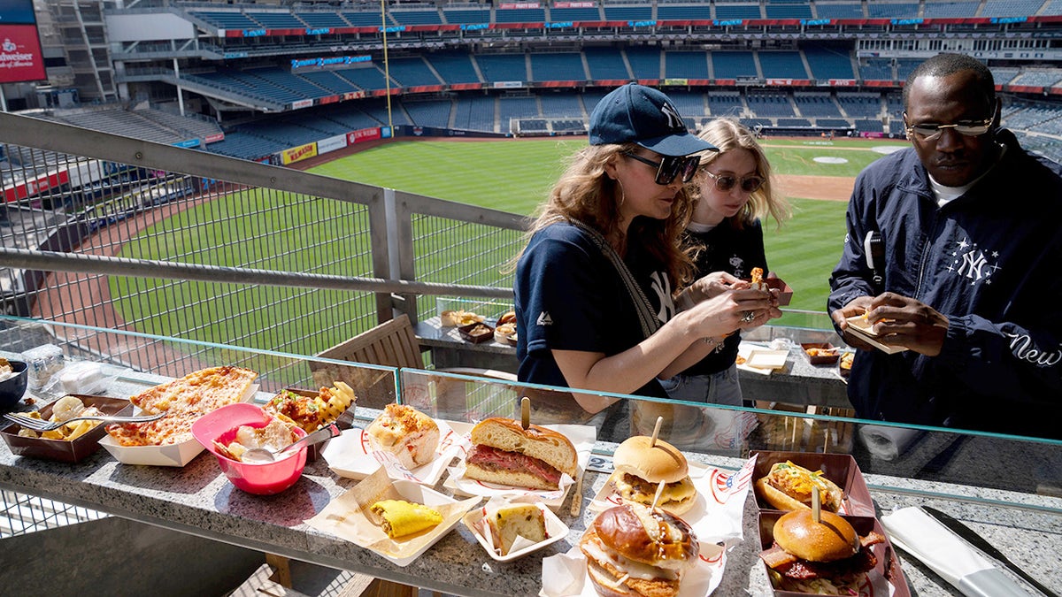 Media trying foods at yankee stadium for concessions preview ahead of Opening Day.