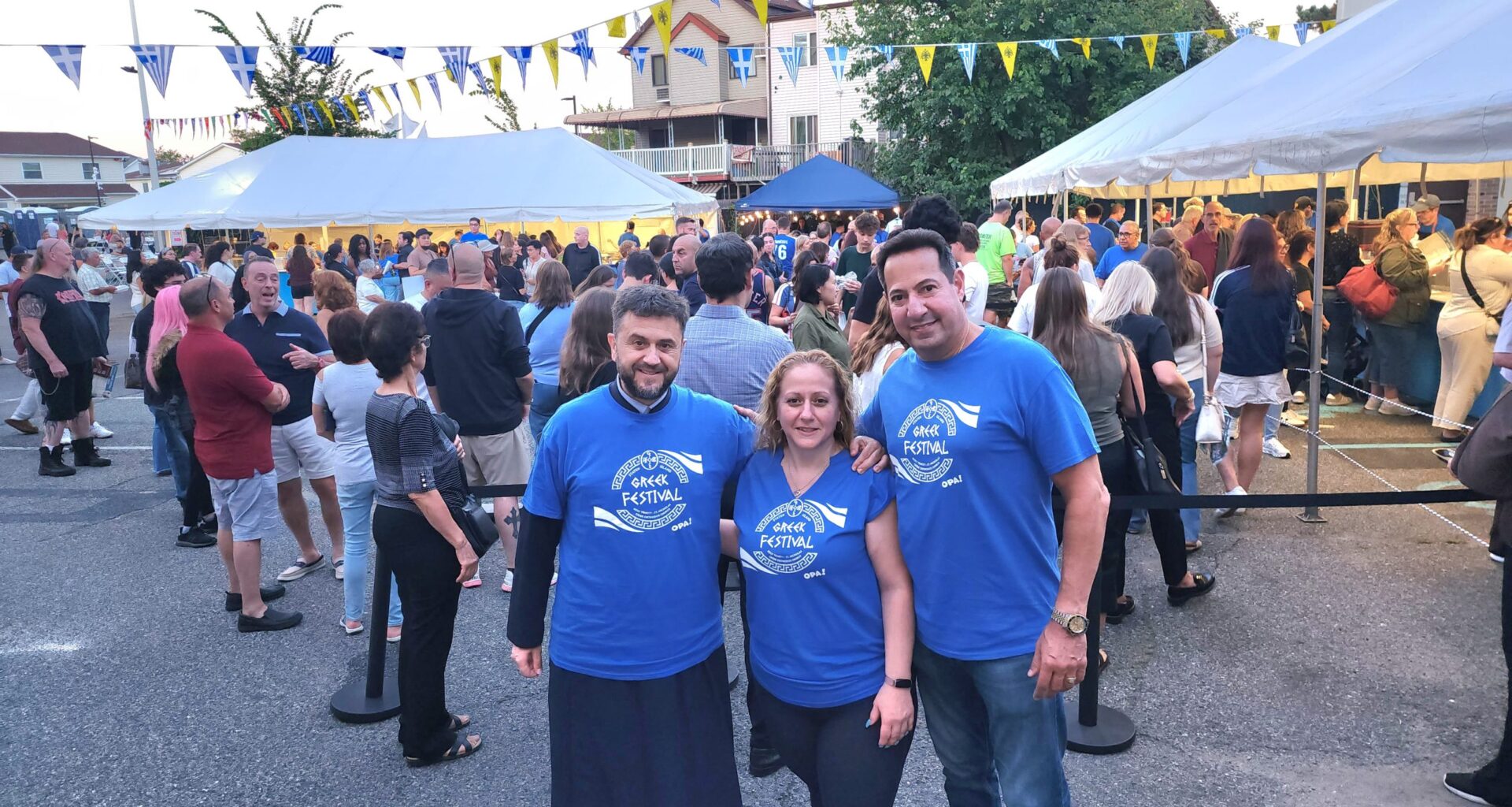 Fr. Vasileios Apostolidis with the president of the Parish Council, Spyro Lazaretos, and the festival coordinator, Anneta Colon. (Photo: National Herald/Michael Kakias)