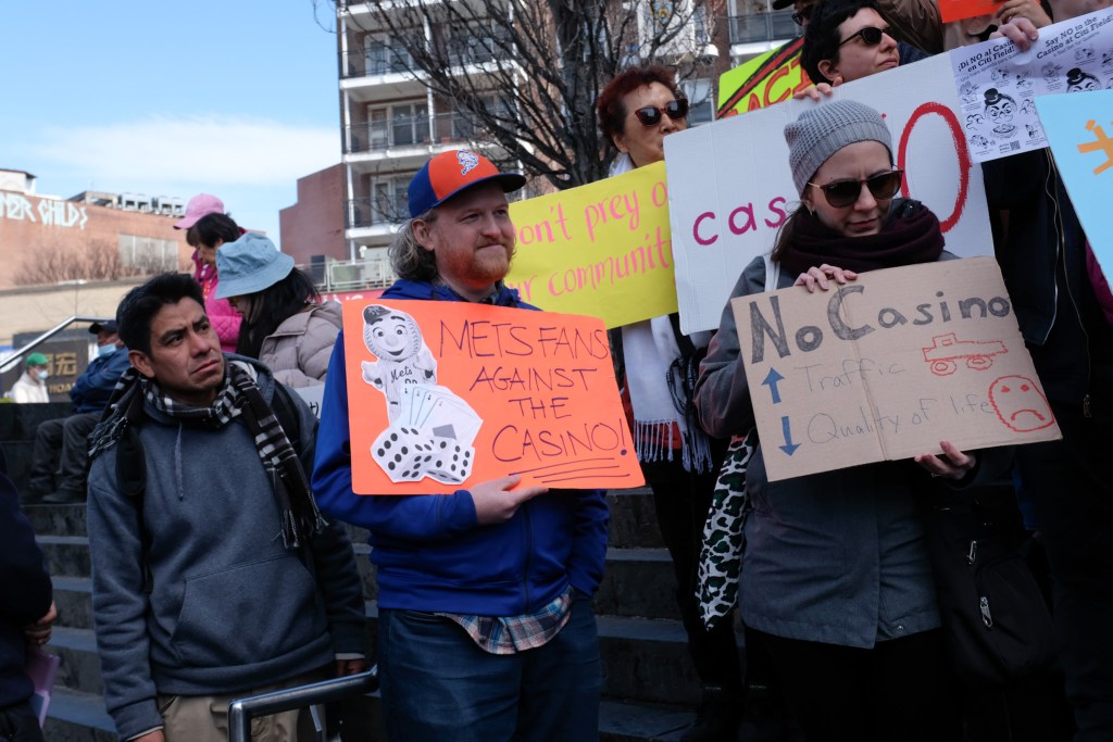 Neighborhood advocates rally at the Flushing Public Library against the proposed casino next to Citi Field.