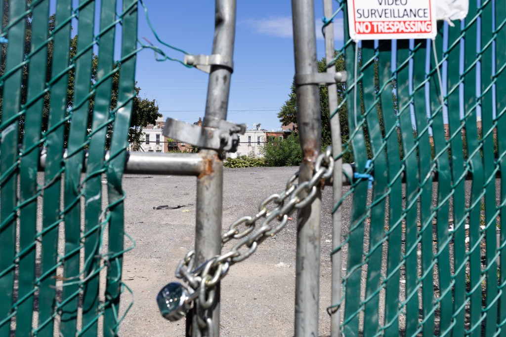 Vehicles were removed from an Elmhurst parking lot where an African burial ground was found,