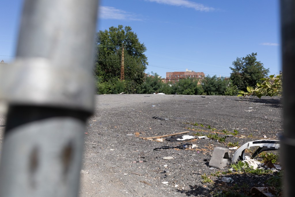 Vehicles were removed from an Elmhurst parking lot where an African burial ground was found