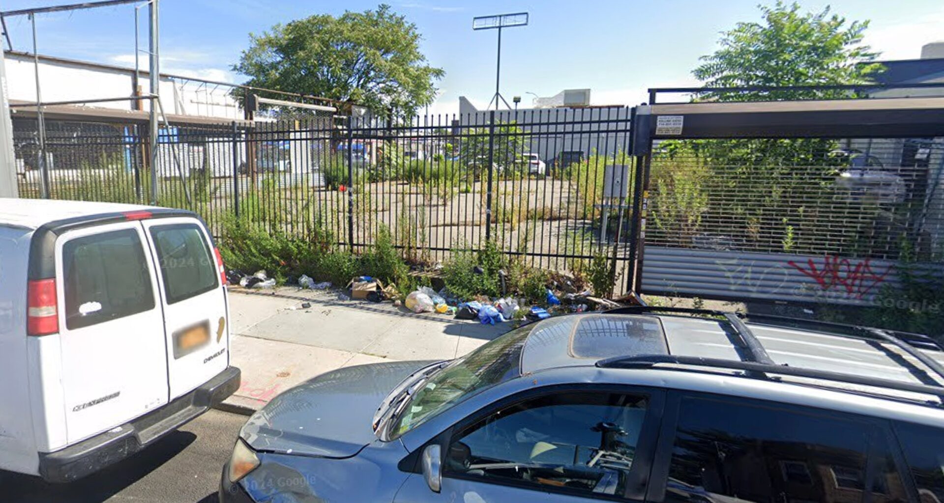 NYPD finds burned body in vacant, trash-filled Queens lot