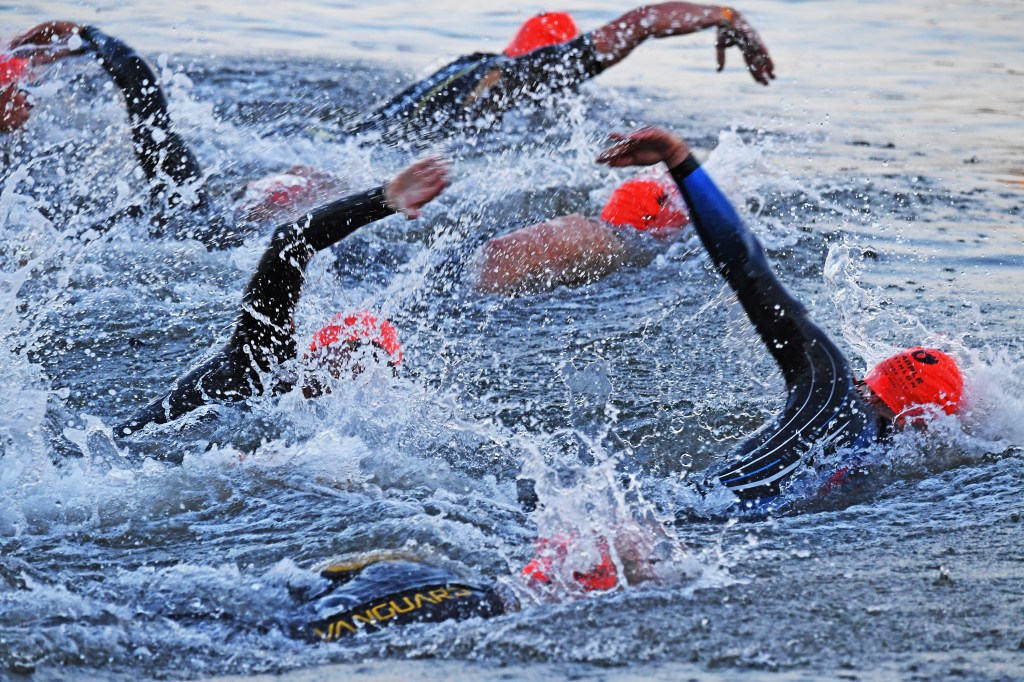 Competitors enter the Hudson River at the start of the NYC Triathlon.