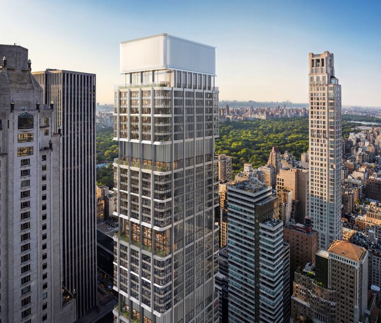 A tall, modern skyscraper with glass windows in an urban setting, surrounded by other high-rise buildings, and a park visible in the background.
