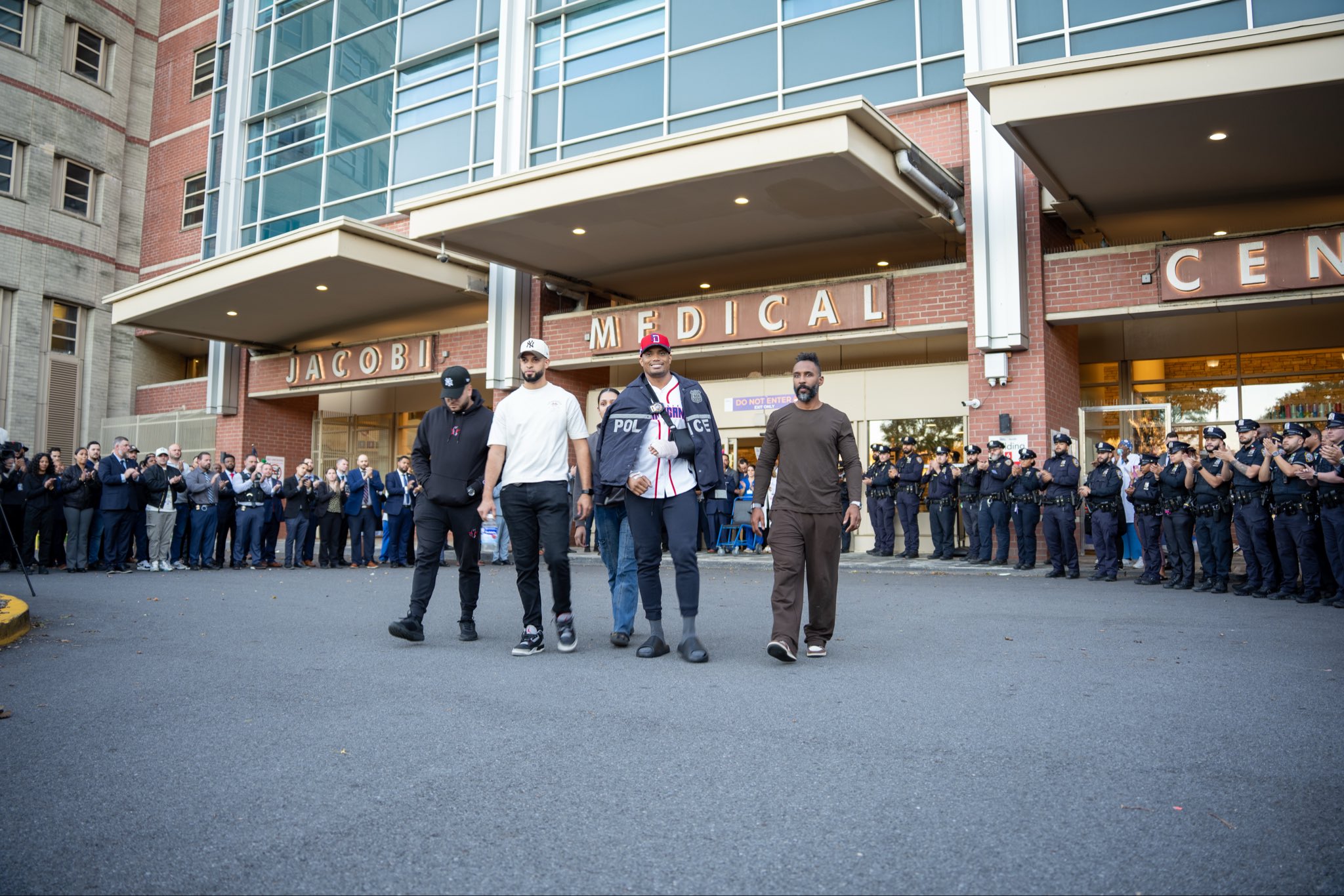 Bronx detective walks out of hospital days after being stabbed as cops cheer