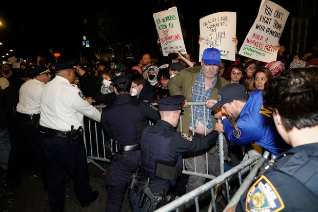 Protesters clash with law enforcement officers after ICE agents shot and wounded a man on Marble Hill Ave. near W. 225th St. in the Bronx on Thursday, Oct. 8, 2026. (Barry Williams / New York Daily News)