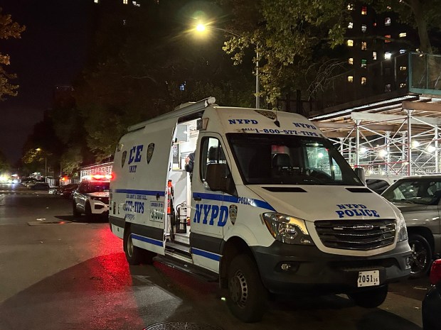 Police investigate after 15-year-old Jihad Pack was fatally shot inside NYCHA's Martin Luther King Jr. Towers on Wednesday.