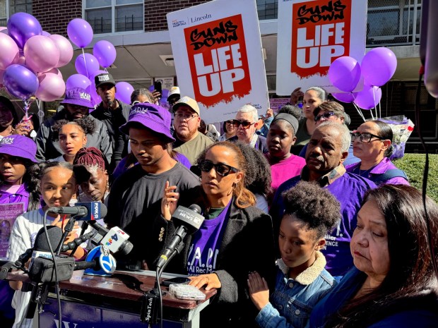 Nathaly Ramirez's mother, Nathaly (in sunglasses), is pictured with family members during a vigil outside her daughter's apartment building on Olinville Ave. in the Bronx on Saturday, Oct. 10, 2026. (Rebecca White / New York Daily News)