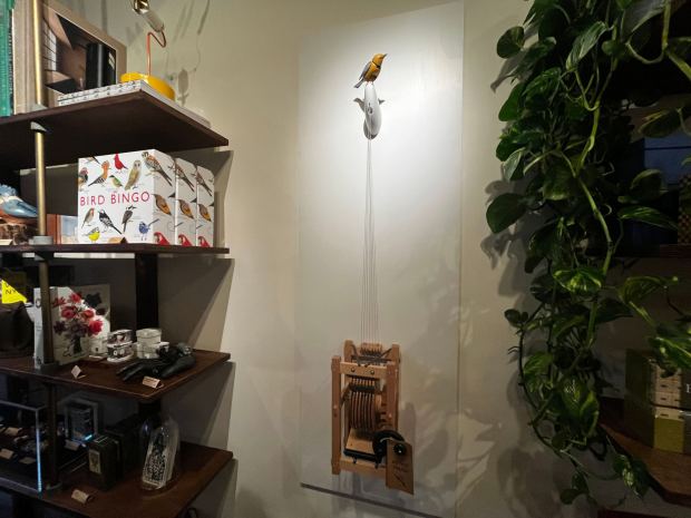 A singing and dancing bird automaton named "Molly" is pictured in Art of Play.