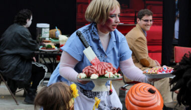 halloween - costumed actor holding fake food
