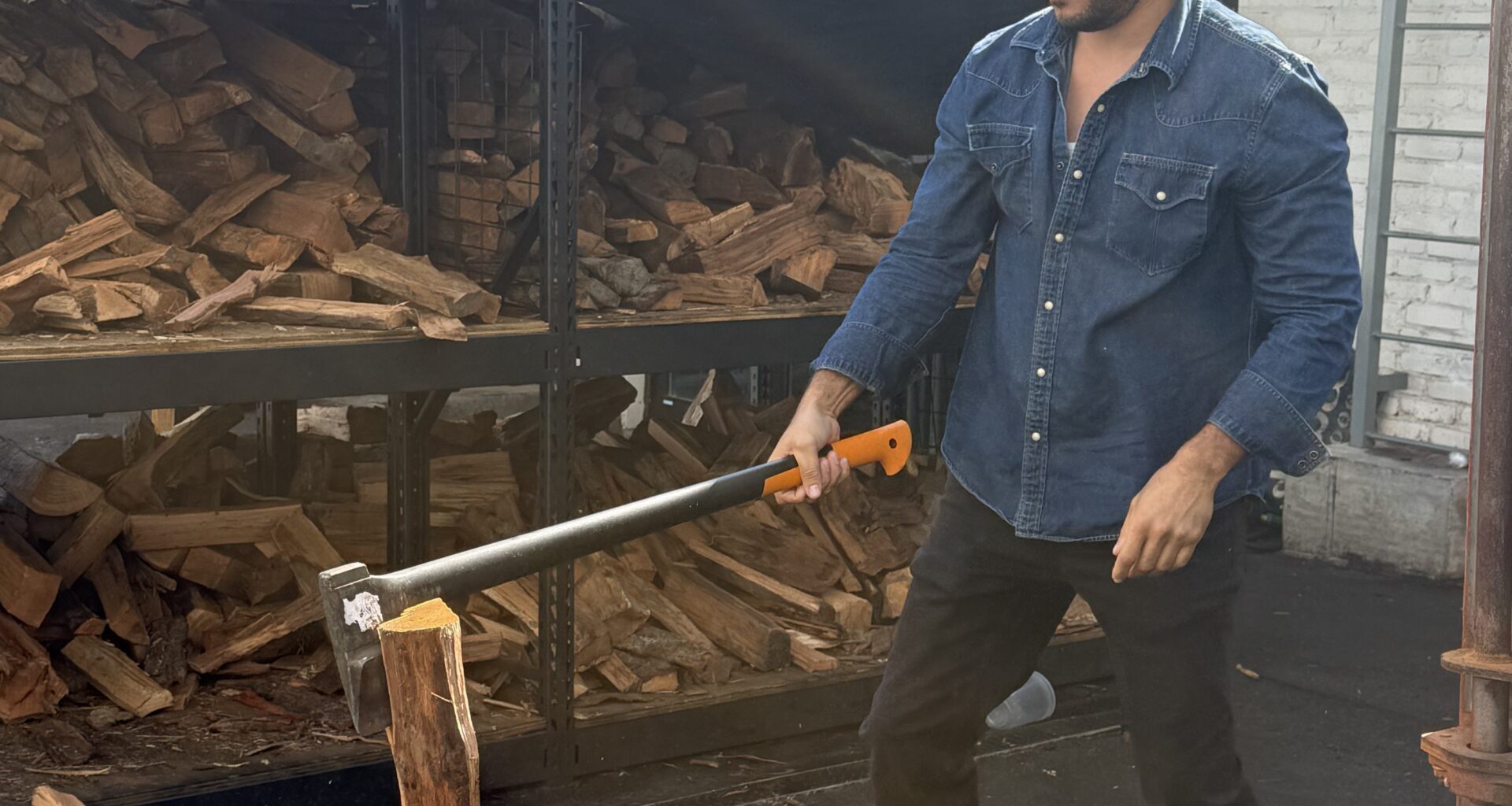 Ruben Santana chopping wood outside Bark BBQ