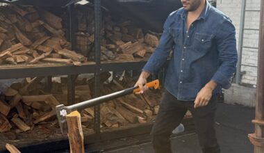 Ruben Santana chopping wood outside Bark BBQ