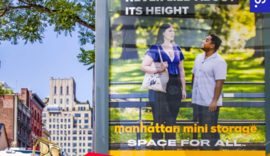Promotional graphic announcing Manhattan Mini Storage as a winner of the 22nd Annual Davey Awards. A gold Davey trophy sits in the bottom left corner.