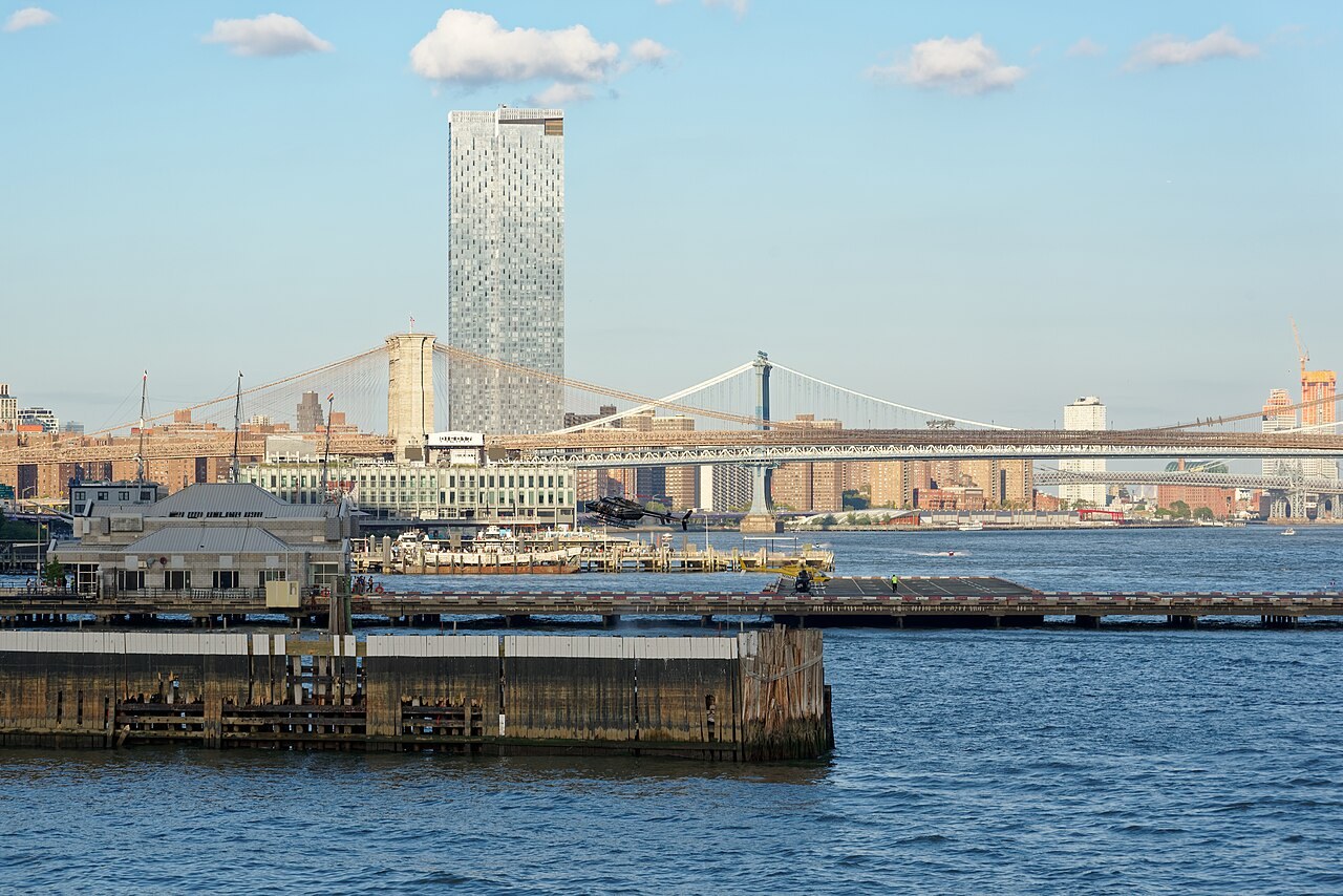 The Downtown Manhattan Heliport at Pier 6 on the East River with the Brooklyn and Manhattan bridges in the background
