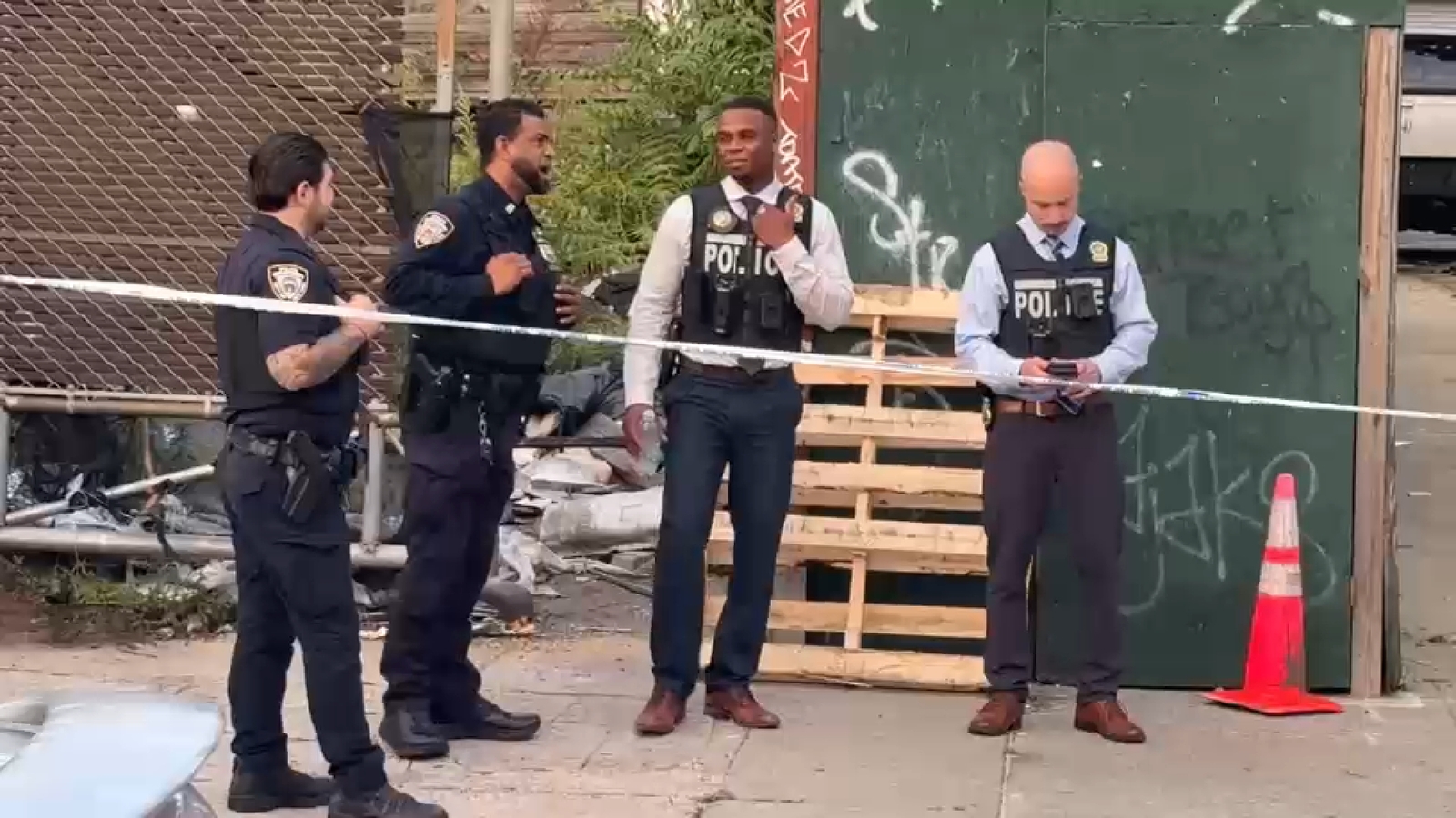 Queens burned body found in cluttered lot in Jamaica, sources say