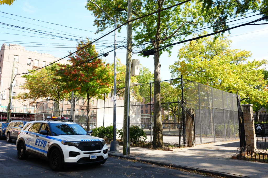 A NYPD police vehicle parked outside The Pearly Gates Park in the Bronx.