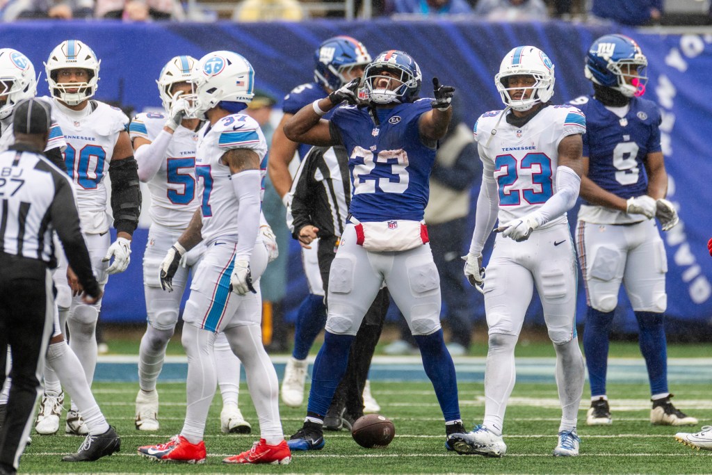 New York Giants running back Najee Harris (23) reacts after running for a large gain during a game against the Tennessee Titans.