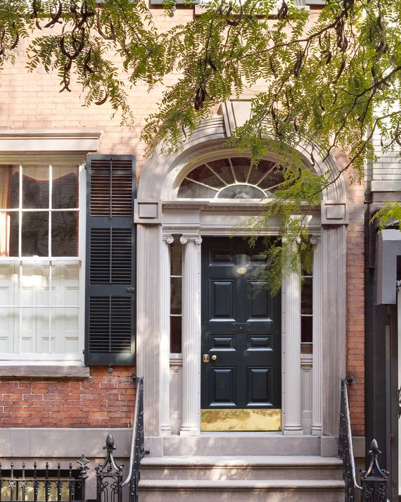 The entryway combines elements of Federal and Greek Revival styles.