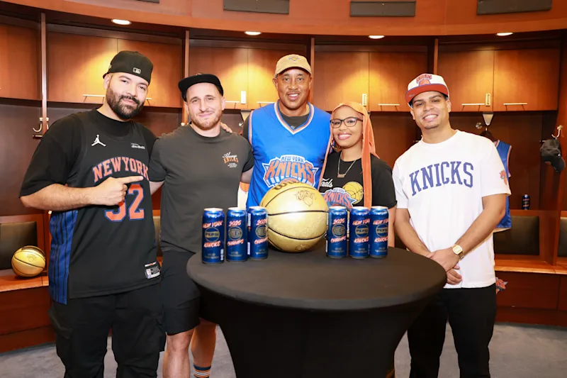 Knicks legend John Starks surprised select fans with an early look at the commemorative cans inside the Knicks’ locker room as part of the “Champions Deserve Pepsi” launch .jpg