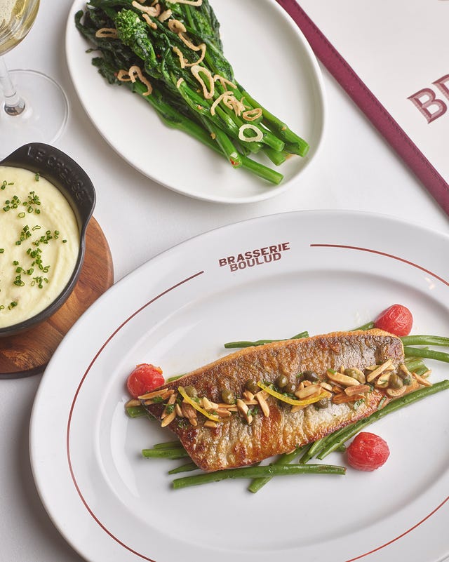 Grilled fish with green beans, cherry tomatoes, and slivered almonds, served with sautéed greens and creamy mashed potatoes. Grilled fish with green beans, cherry tomatoes, and slivered almonds, served with sautéed greens and creamy mashed potatoes.