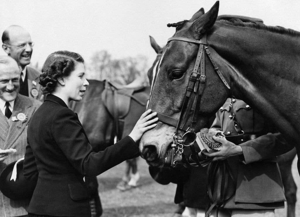 The affectionate photo is similar to this one of the late Queen taken in 1953 