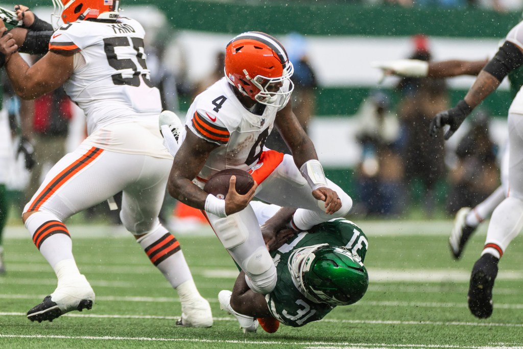 New York Jets linebacker David Bailey tackles Cleveland Browns quarterback Deshaun Watson.
