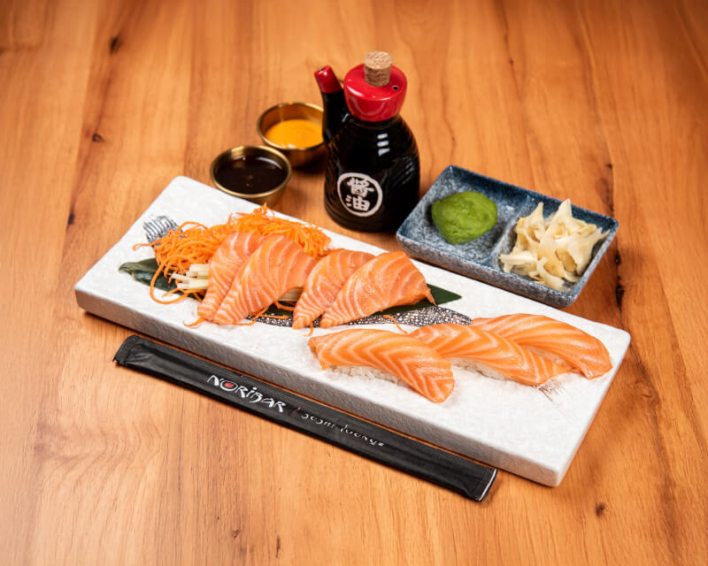 Salmon nigiri and sashimi with Noribar branded chopsticks