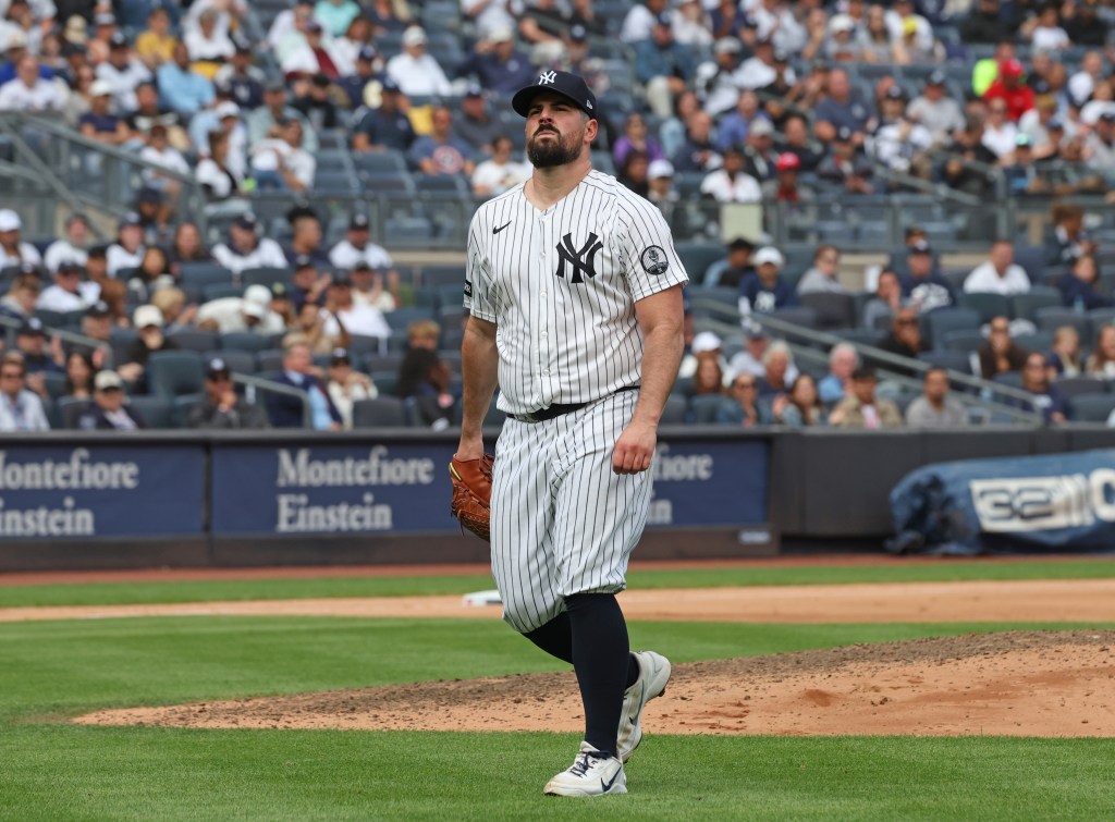 New York Yankees pitcher Carlos Rodón reacts on the field.
