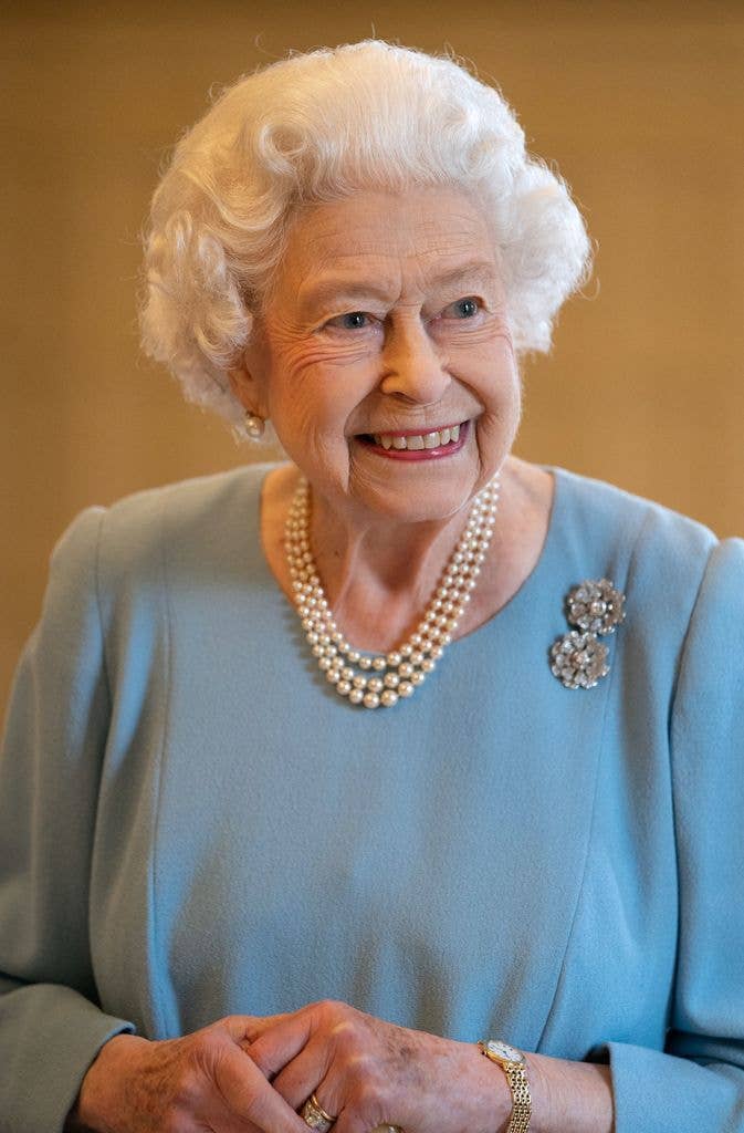 Queen Elizabeth II smiles during a reception in the Ballroom of Sandringham House
