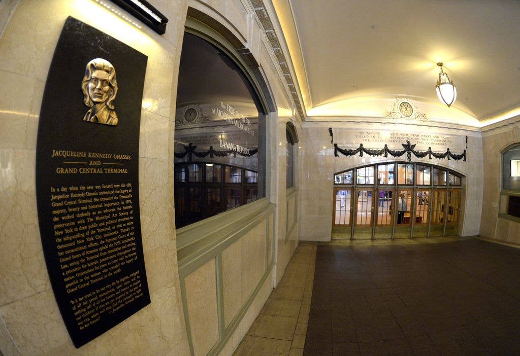 A dedication plaque of Jacqueline Kennedy Onassis is viewed after a ceremony June 30, 2014 to dedicate Grand Central Terminal's renovated main entry vestibule in memory of first lady Jacqueline Kennedy Onassis, a former president of The Municipal Art Society of New York and former chairman of the city Landmarks Preservation Commission. Her efforts led to the U.S. Supreme Court upholding the city's Landmark Law in 1978 and saving Grand Central from having a 53-story tower built atop it