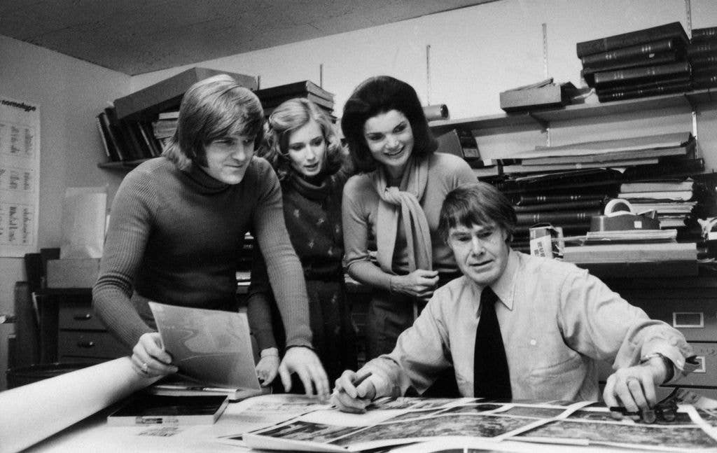 Christopher Holme, Gael Towey Dillon, Jacqueline Onassis and Bryan Holme (l to r) in the Studio Books Department at the Viking Press in New York, 1977
