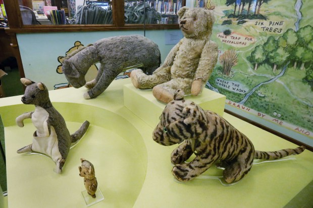 The WInnie-the-Pooh story characters are displayed at the main branch of the New York Public Library, Wednesday, Aug. 3, 2016. (AP Photo/Richard Drew)
