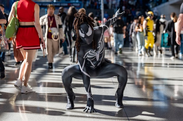 RL Radeke cosplays as Spider-Man from the The Marvel Universe while attending Comic Con at the Jacob K. Javits Convention Center on Friday, Oct. 9, 2026, in New York. (AP Photo/David 'Dee' Delgado)