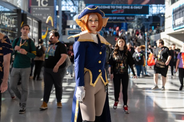 Nicolina Steinhoff cosplays as Captain Amelia from Treasure Planet while attending Comic Con at the Jacob K. Javits Convention Center on Friday, Oct. 9, 2026, in New York. (AP Photo/David 'Dee' Delgado)