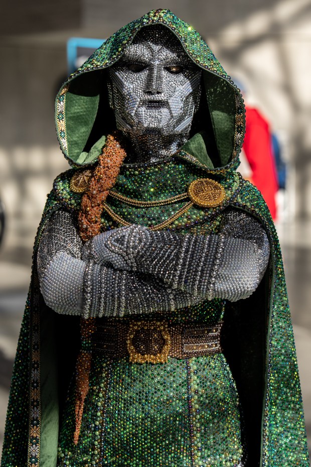 Anne-Marie villeneuve cosplays as Dr.Doom from the The Marvel Universe attends Comic Con at the Jacob K. Javits Convention Center on Friday, Oct. 9, 2026, in New York. (AP Photo/David 'Dee' Delgado)
