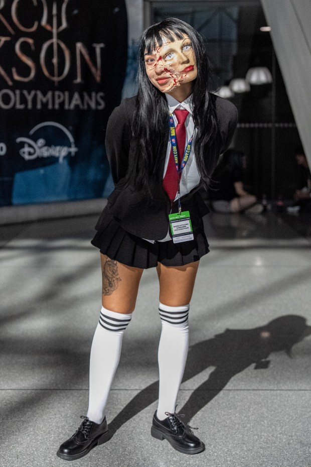 Melanie Witherspoon cosplays as Tomie Junji-Ito from the manga series Tomie at Comic Con at the Jacob K. Javits Convention Center on Friday, Oct. 9, 2026, in New York. (AP Photo/David 'Dee' Delgado)