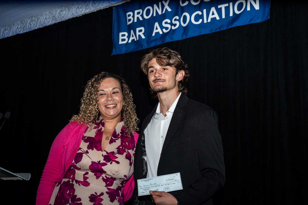Shantel Castro poses alongside the Honorable Gerald V. Esposito Memorial “courage” Scholarship awardee, Massimo Parrinello.