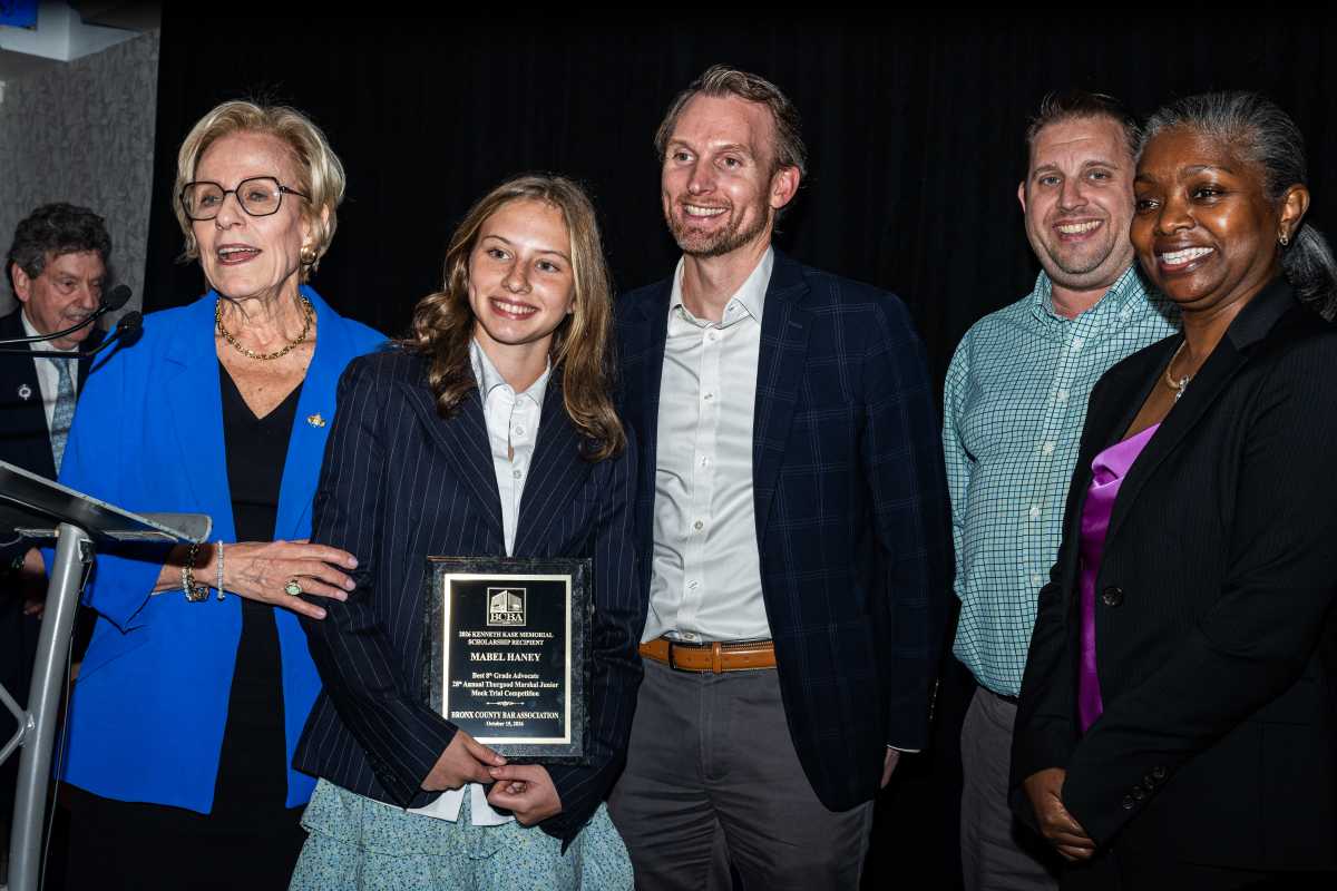 Dr. Sandra Kase presents the Best 8th-Grade Advocate Award to Mabel Haney.