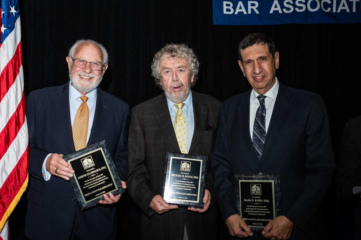 From left: Joseph Giampalo, Michael B. Doyle, and Mark B. Rubin posing in celebration of the 50th anniversary of their admission to the Bronx County Bar Association.
