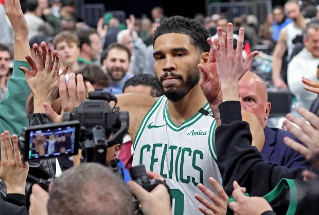 Boston Celtics star Jayson Tatum celebrates a thrilling overtime win over the Nets as he leaves the court. Stuart Cahill/Boston Herald