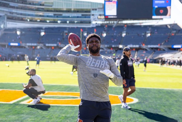 Bears cornerback Tyrique Stevenson plays catch with fans before the game against the Jets on Oct. 4, 2026, at Soldier Field in Chicago. (Brian Cassella/Chicago Tribune)