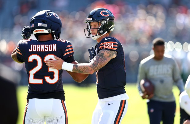 Chicago Bears quarterback Tyson Bagent (17) and running back Roschon Johnson (23) warm up for a game against the New York Jets at Soldier Field in Chicago on Oct. 4, 2026. (Chris Sweda/Chicago Tribune)
