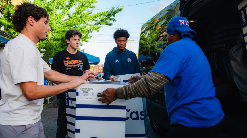 New York City FC Players Nico Cavallo, left, Mac Learned and Max Murray help load Casper beds for delivery. Photo Courtesy New York City FC.
