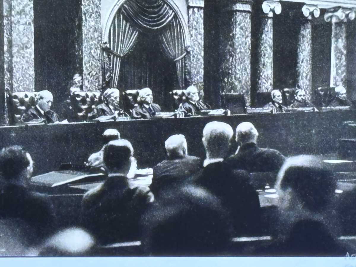 Charles Evan Hughes presiding over Supreme Court in surreptitiously taken photograph